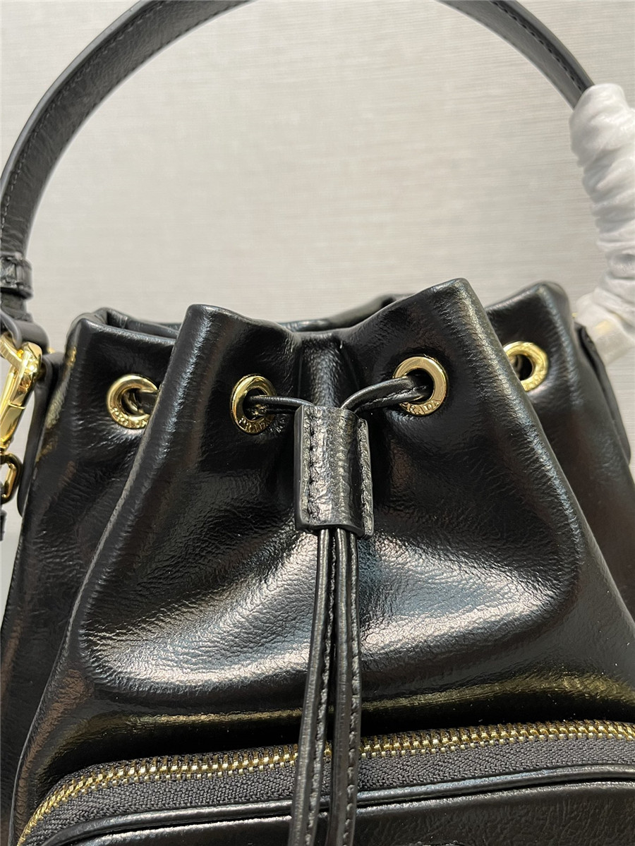 Pra*a black leather bucket crossbody bag