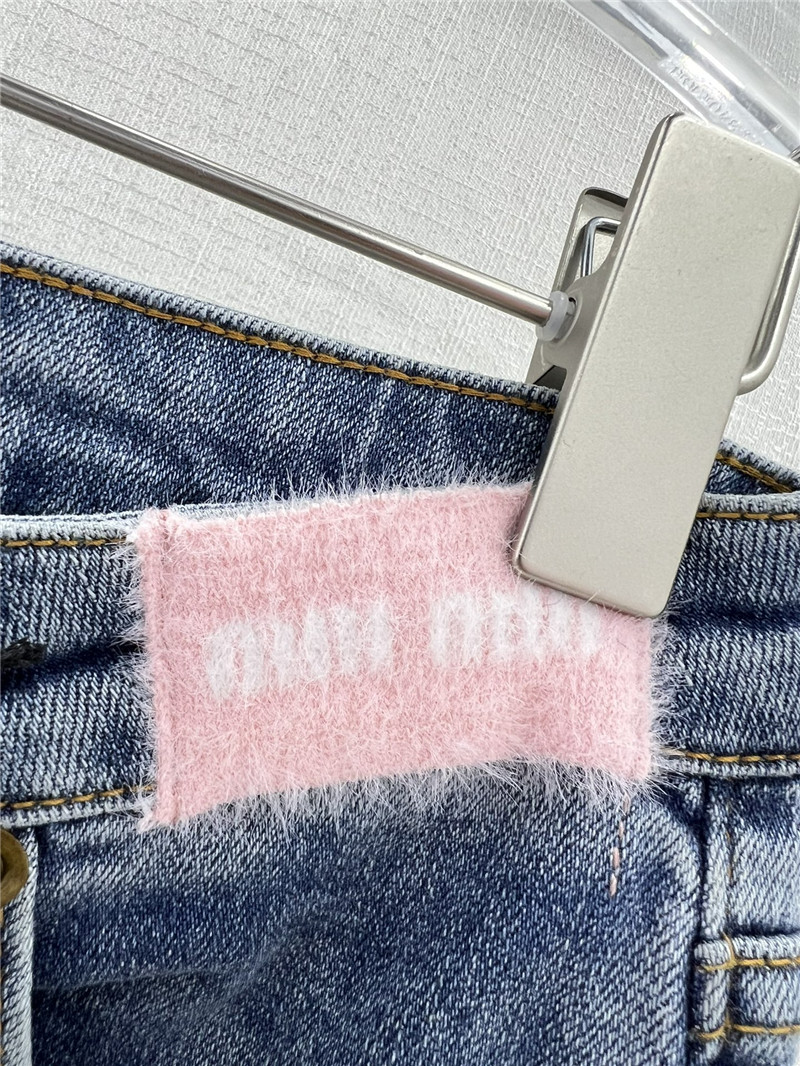 M1um1u waistband letter patch logo embellished jeans