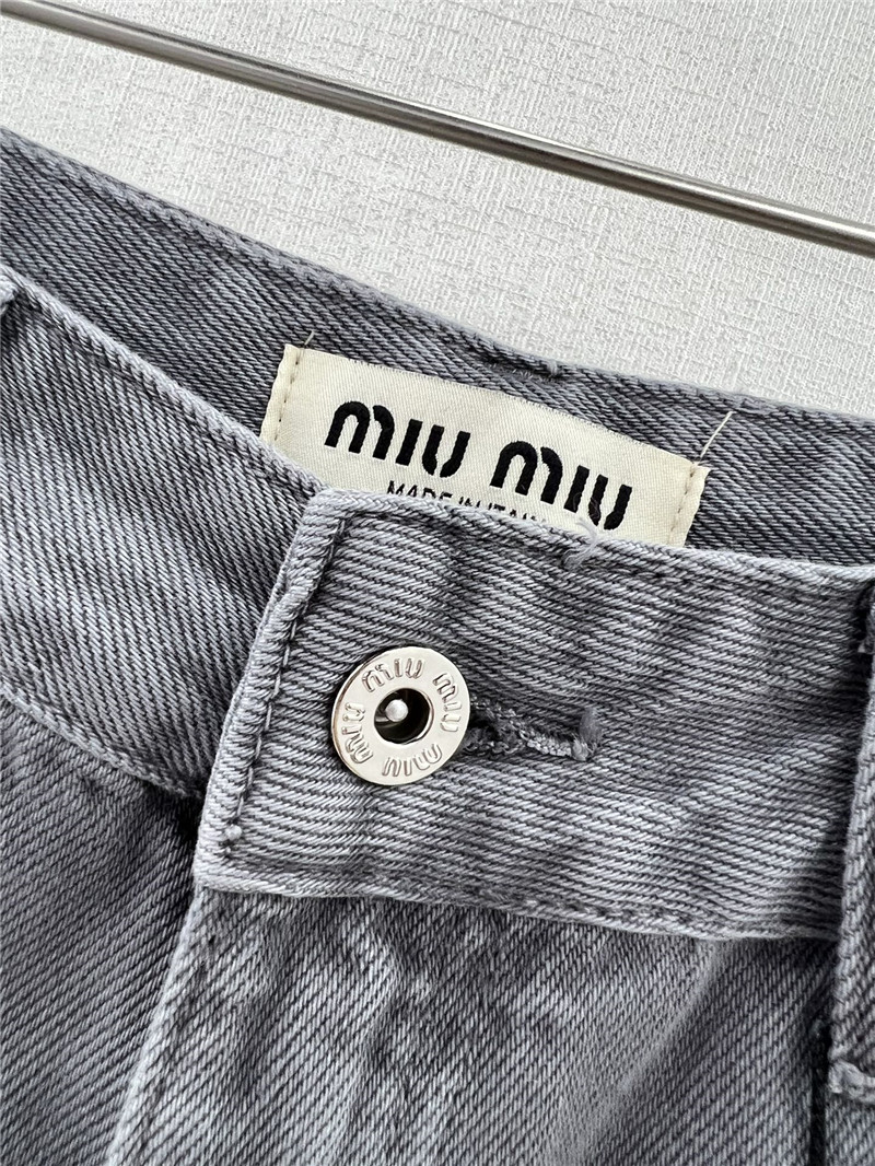 M1um1u waistband letter patch logo embellished jeans