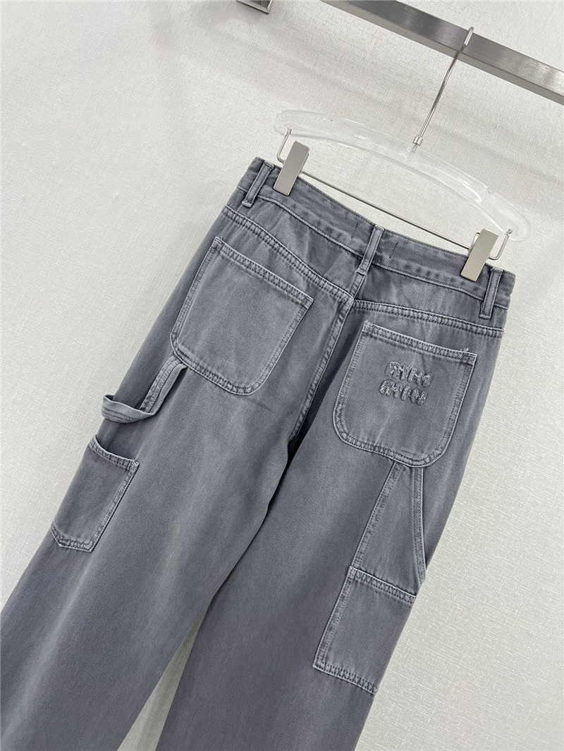 M1um1u waistband letter patch logo embellished jeans