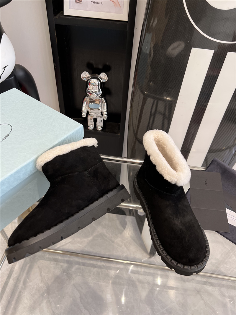 Pra*a triangle-logo suede boots in black