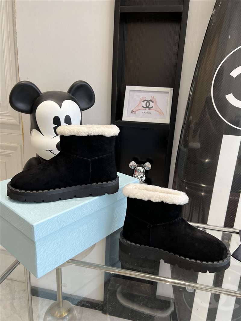 Pra*a triangle-logo suede boots in black