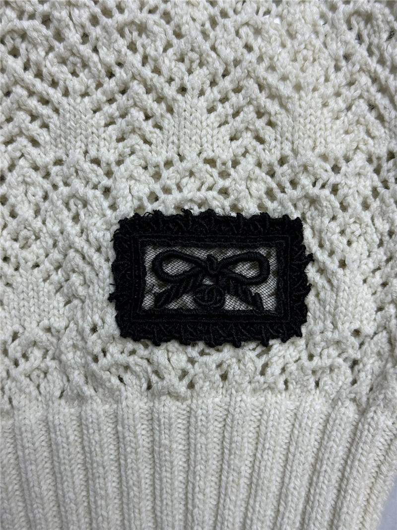 Ch**el hollow short sweater