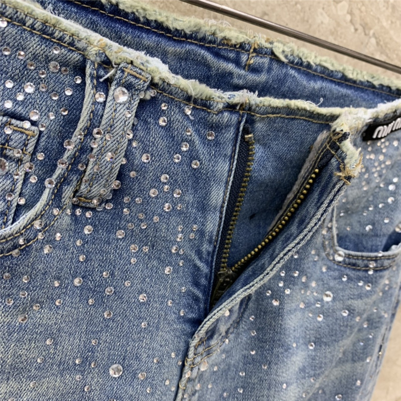 M1um1u micro logo embellished bootcut jeans