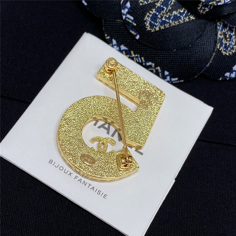 Ch**el denim 5 word double c brooch