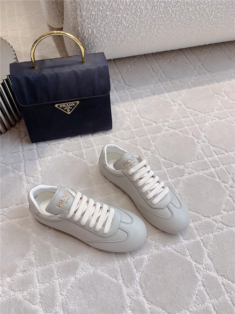 Pra*a triangle logo sneakers in gray