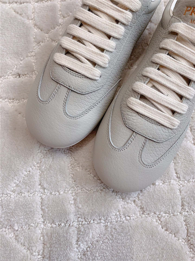 Pra*a triangle logo sneakers in gray