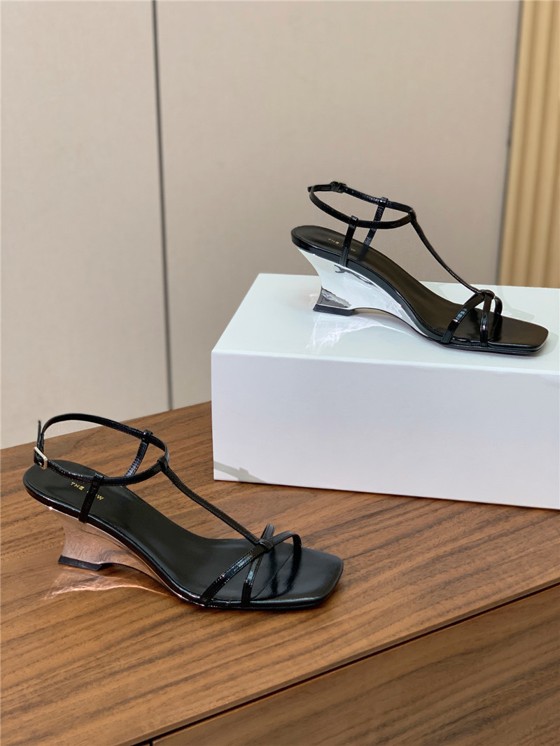 The R0w black patent leather wedge sandals