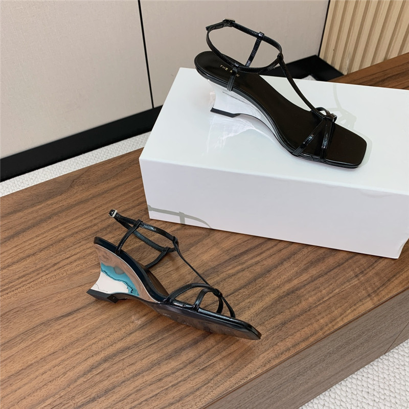 The R0w black patent leather wedge sandals