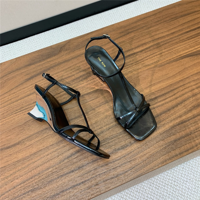 The R0w black patent leather wedge sandals