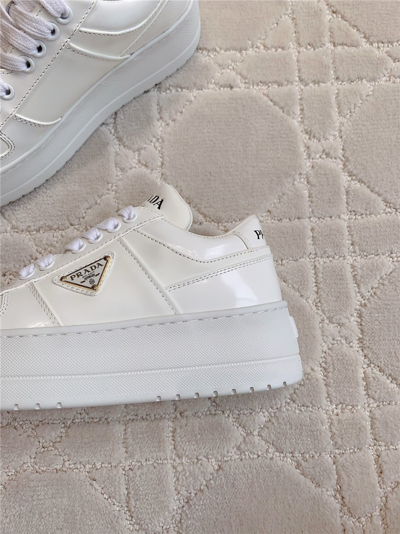 Pra*a triangle-logo white lace-up sneakers