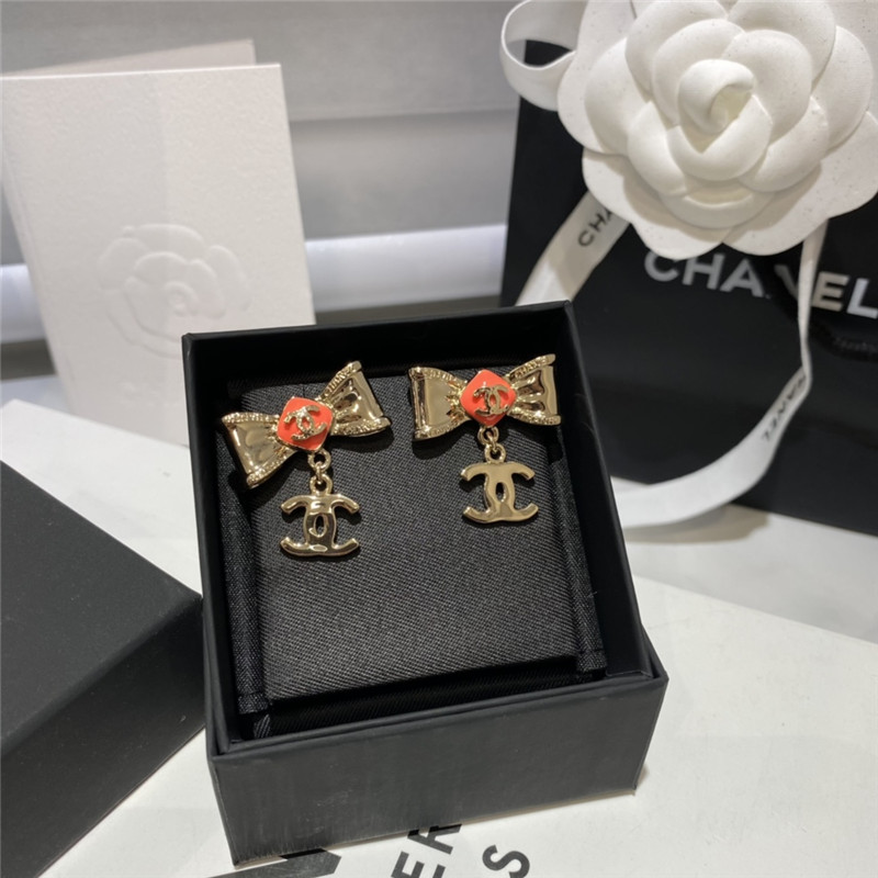 Ch**el orange bow engraved earrings
