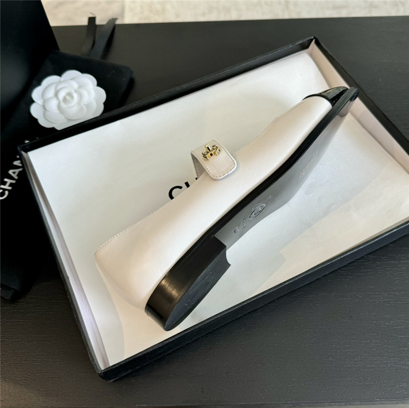 Ch**el gold interlock mary janes in white and black calfskin