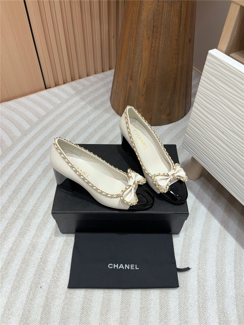 Ch**el bow chain trim ballet pumps in white and black leather