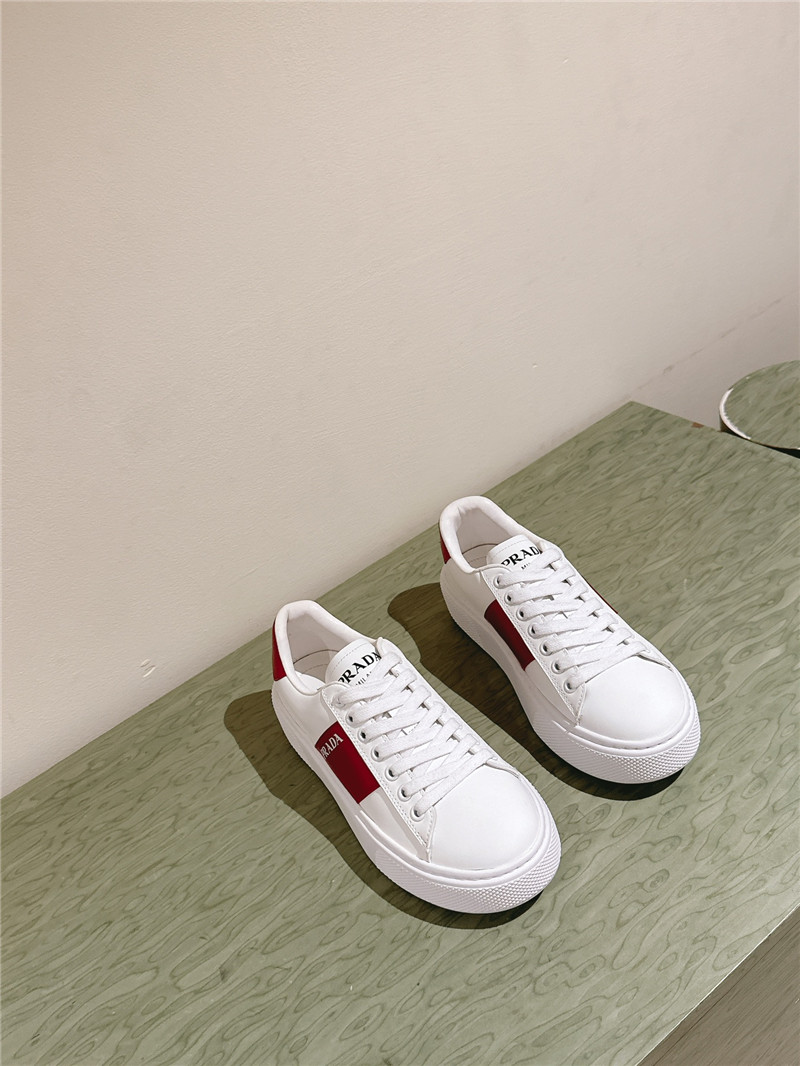 Pra*a white laced low-top sneakers