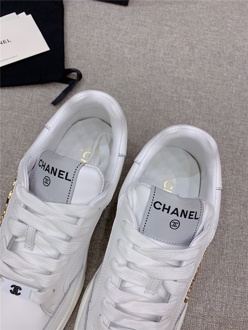 Ch**el white lace-up trainers