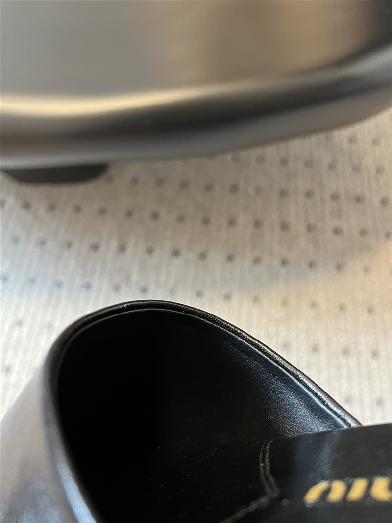 Miu Miu Black Leather Slippers with Embossed Logo