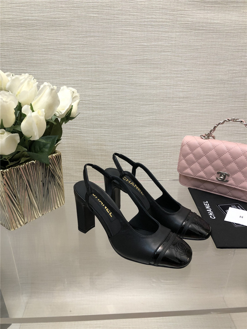 Ch**el black goatskin and patent leather slingbacks