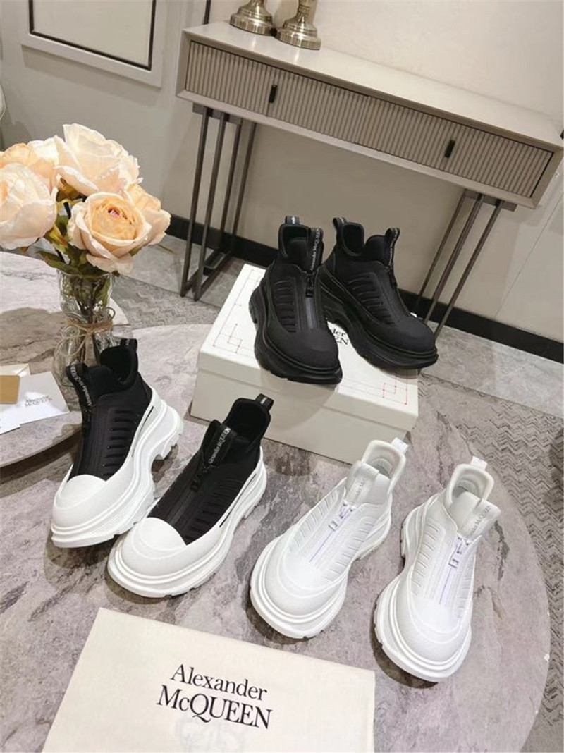 a1exa*der Mcqv*en black zip-up low top sneakers