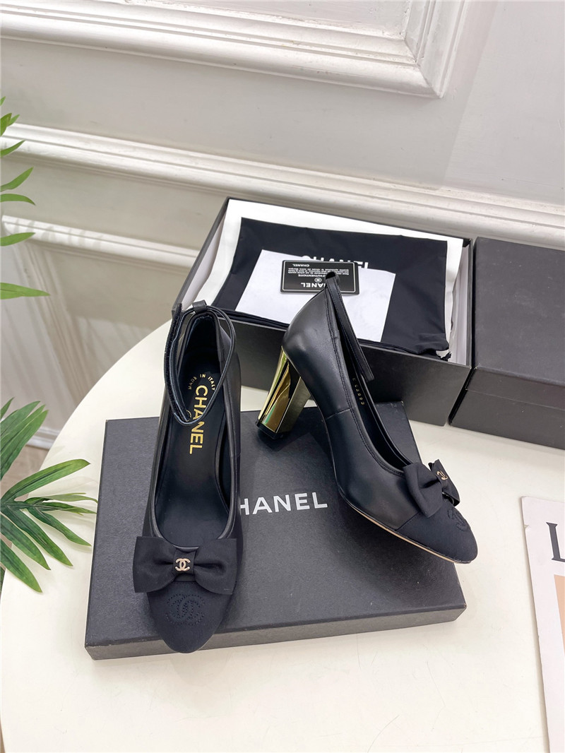 Ch**el bow mary jane heel pumps in black calfskin
