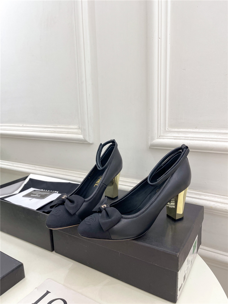 Ch**el bow mary jane heel pumps in black calfskin