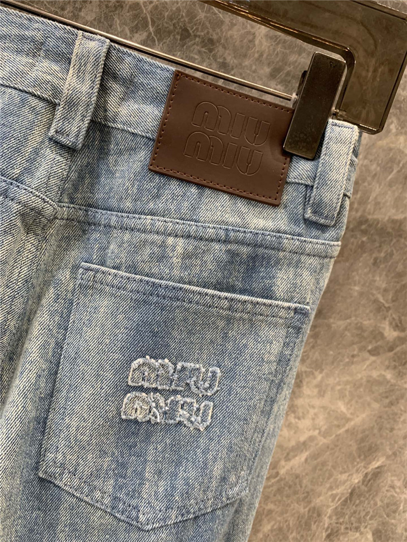 M1um1u striped tie-dye denim trousers