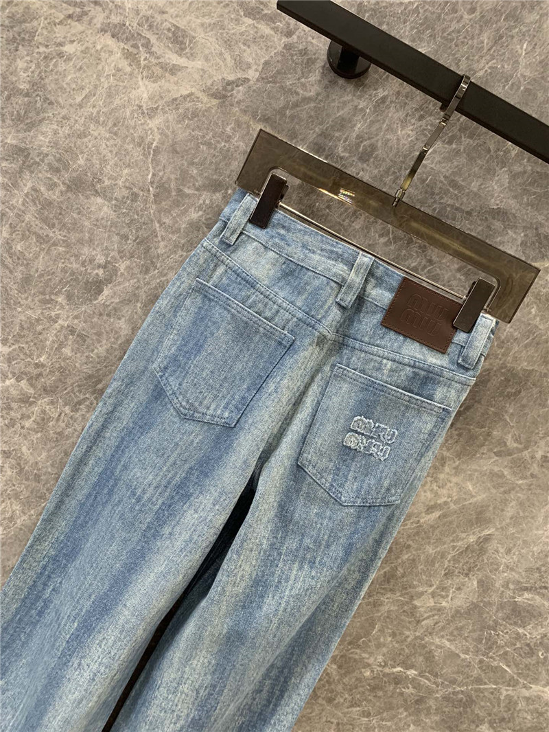 M1um1u striped tie-dye denim trousers