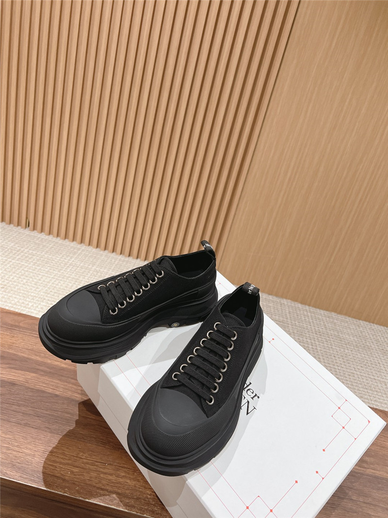 a1exa*der Mcqv*en black tread slick low top sneakers