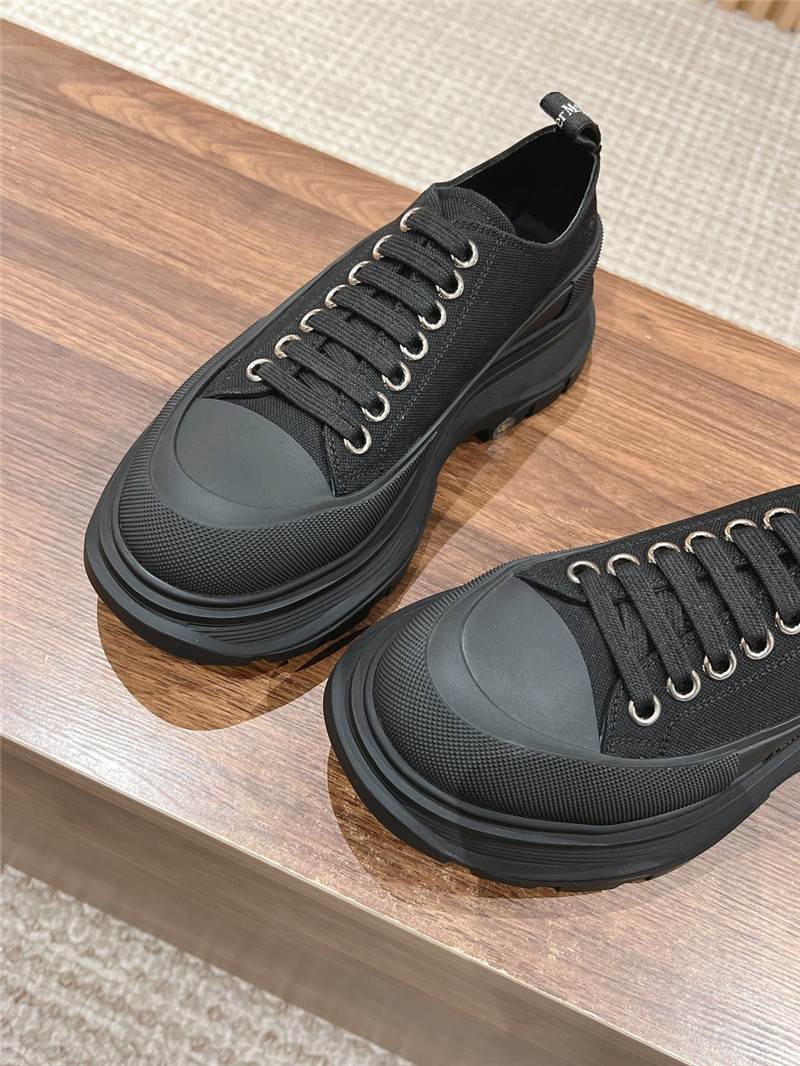 a1exa*der Mcqv*en black tread slick low top sneakers