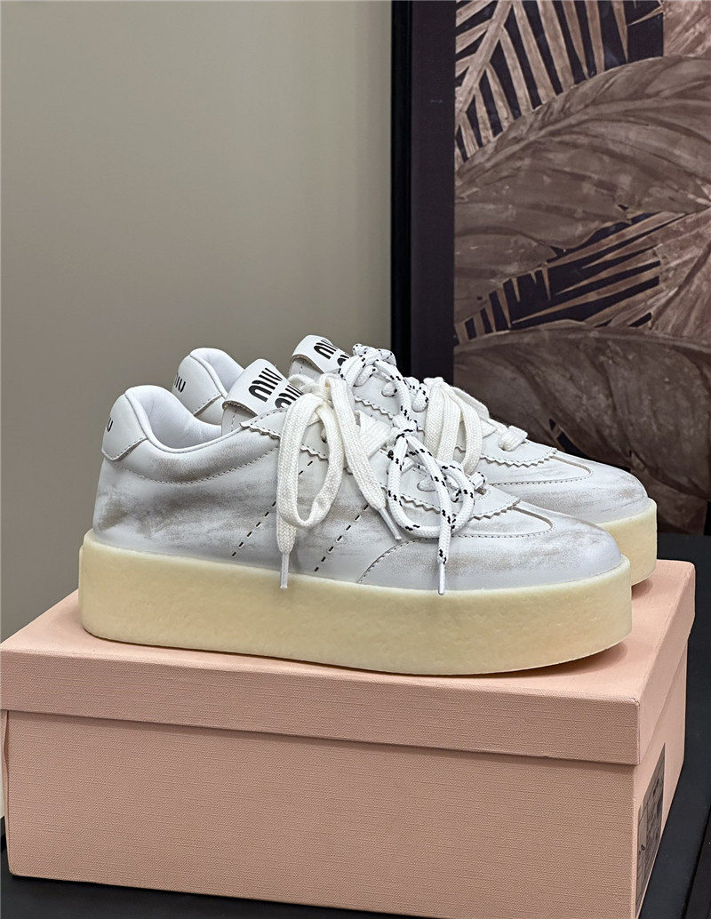 Miu Miu Bleached Leather Low Top Sneakers
