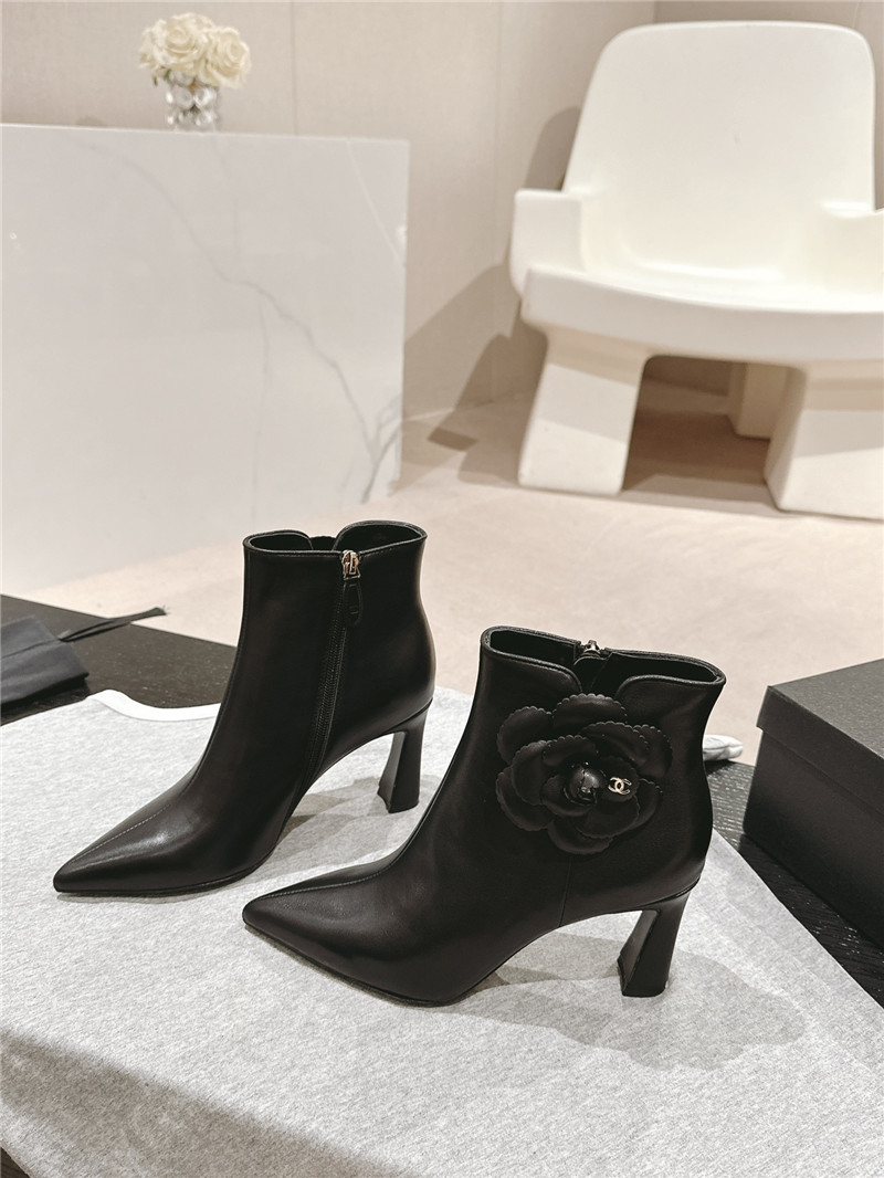 Ch**el heel black calfskin pointed toe boots