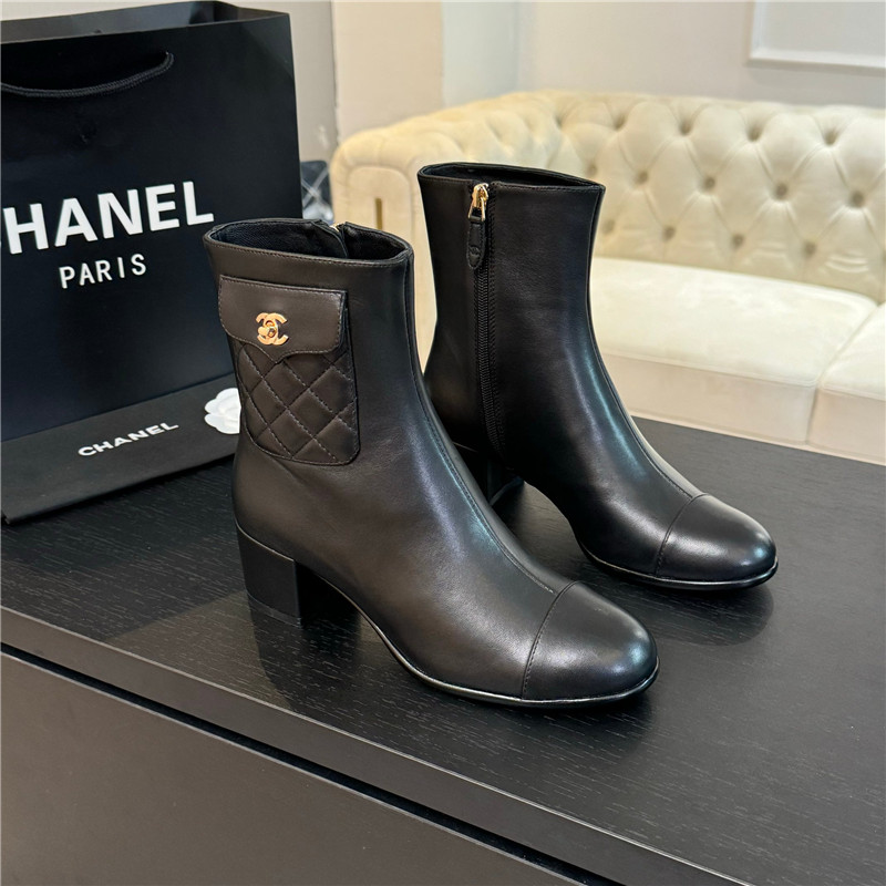 Ch**el black calfskin cap toe ankle boots