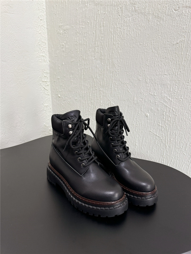 Pra*a black leather and re-nylon booties