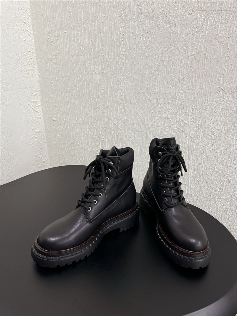 Pra*a black leather and re-nylon booties