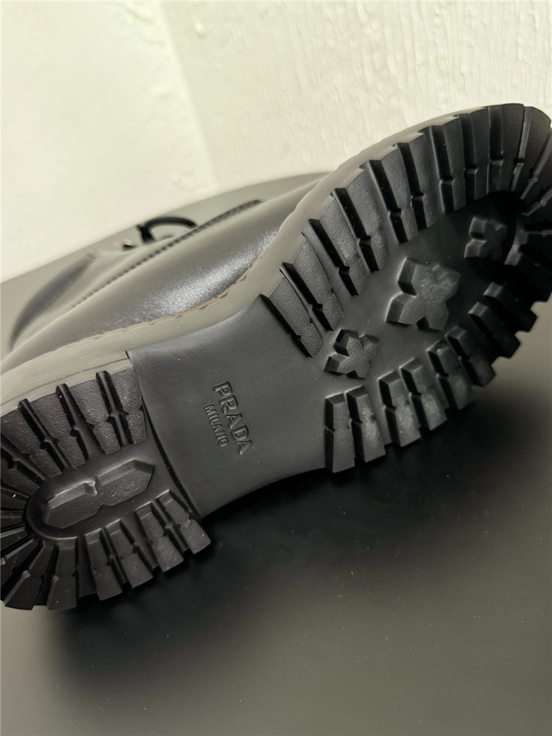 Pra*a black leather and re-nylon booties