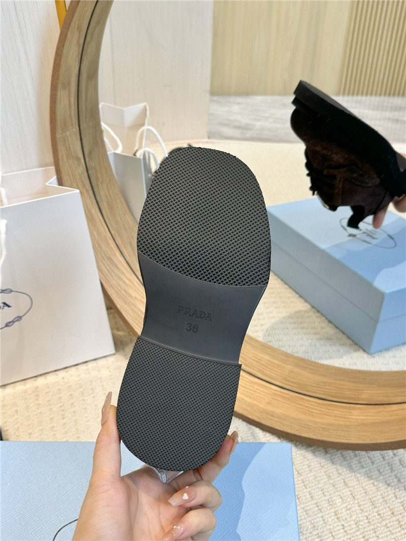 Pra*a brown suede leather triangle logo loafers