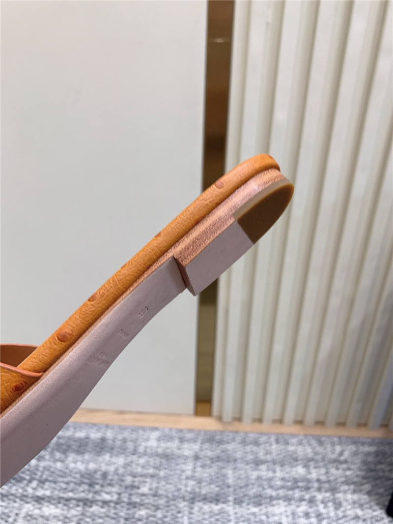 Y51 tribute mules in orange ostrich leather