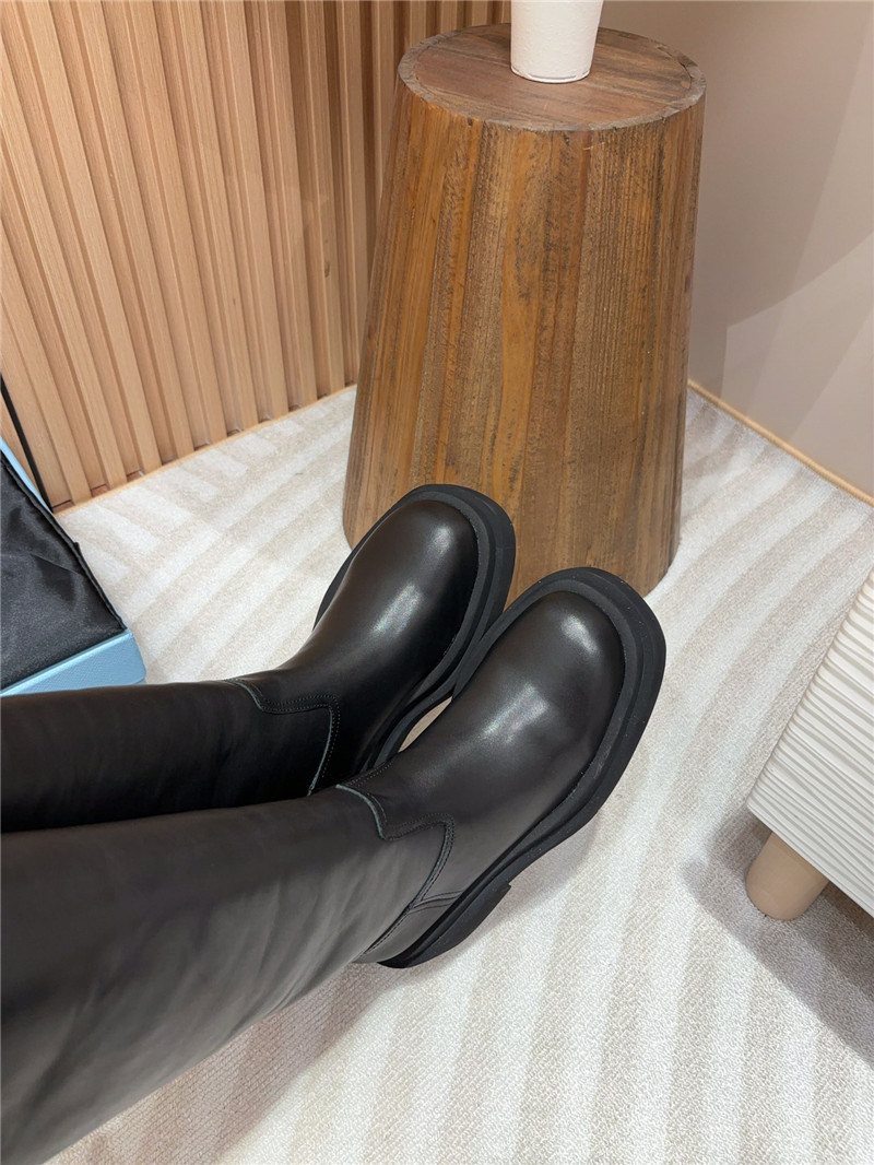 Pra*a women logo plaque leather boots in black