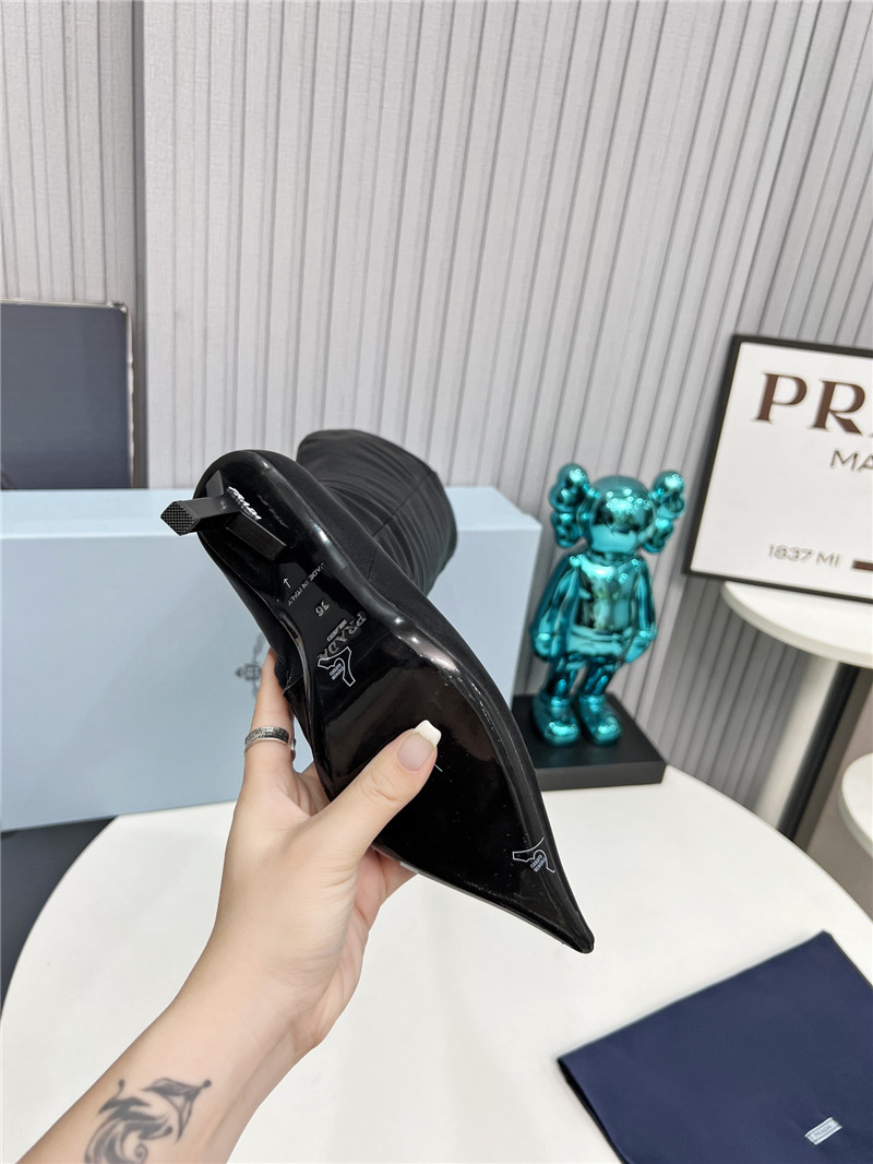 Pra*a black heel knee high boots