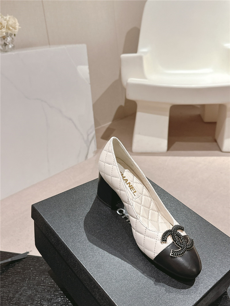 Ch**el white/black quilted leather cap toe pumps