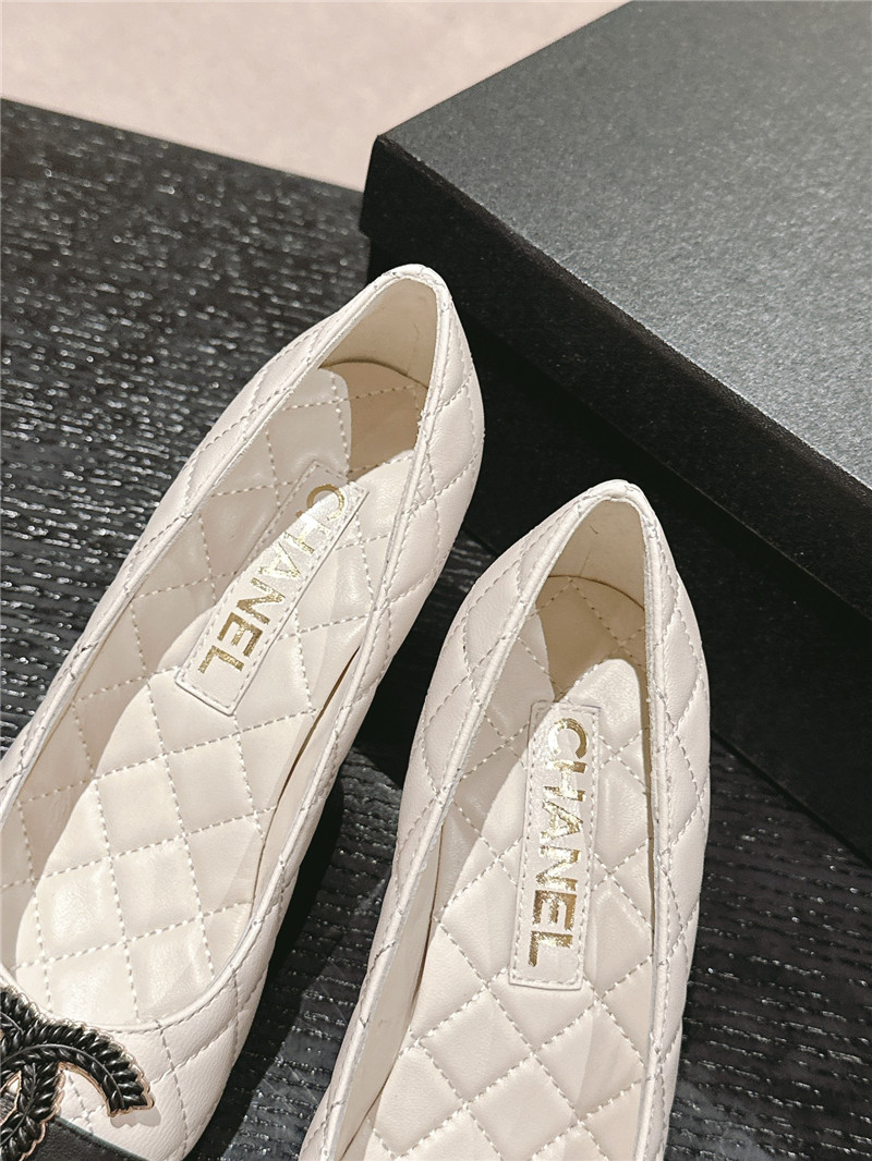 Ch**el white/black quilted leather cap toe pumps