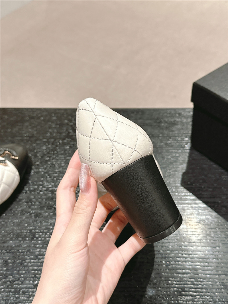 Ch**el white/black quilted leather cap toe pumps