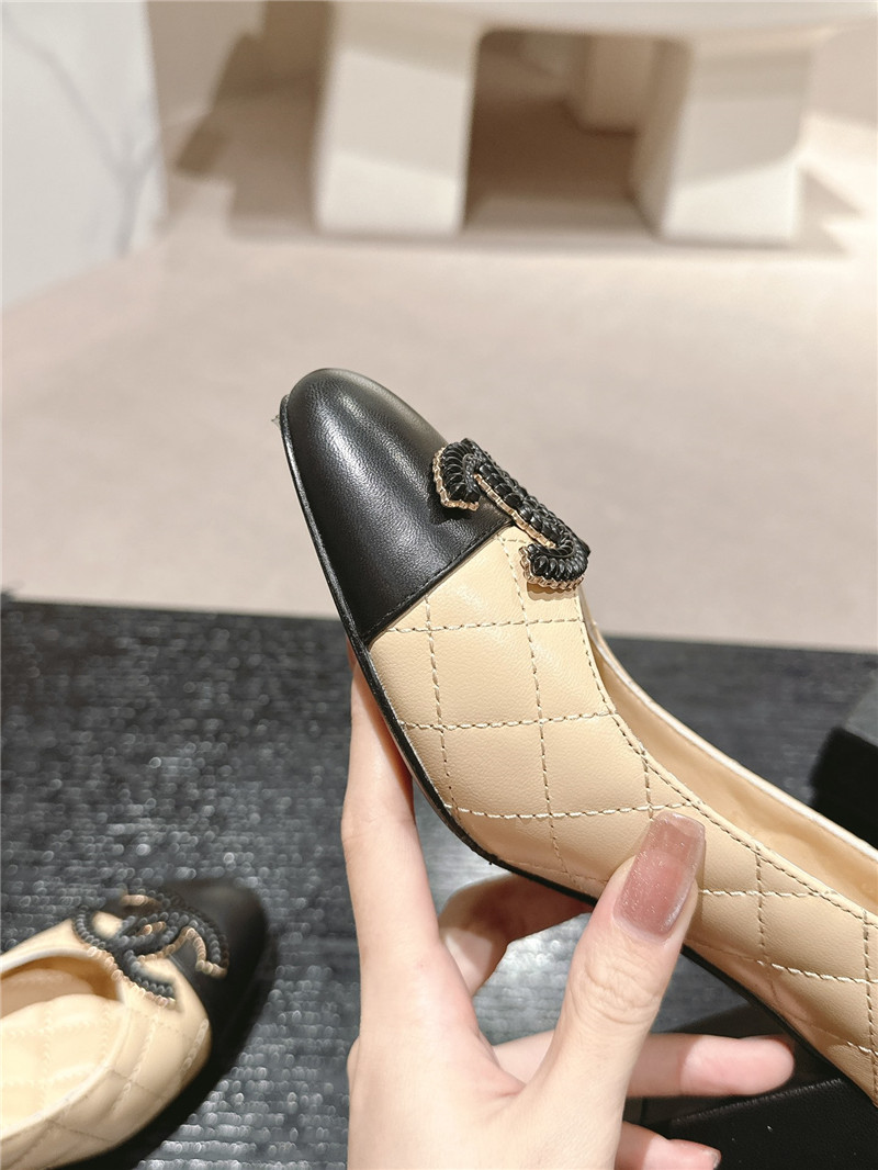 Ch**el beige/black quilted leather cap toe pumps