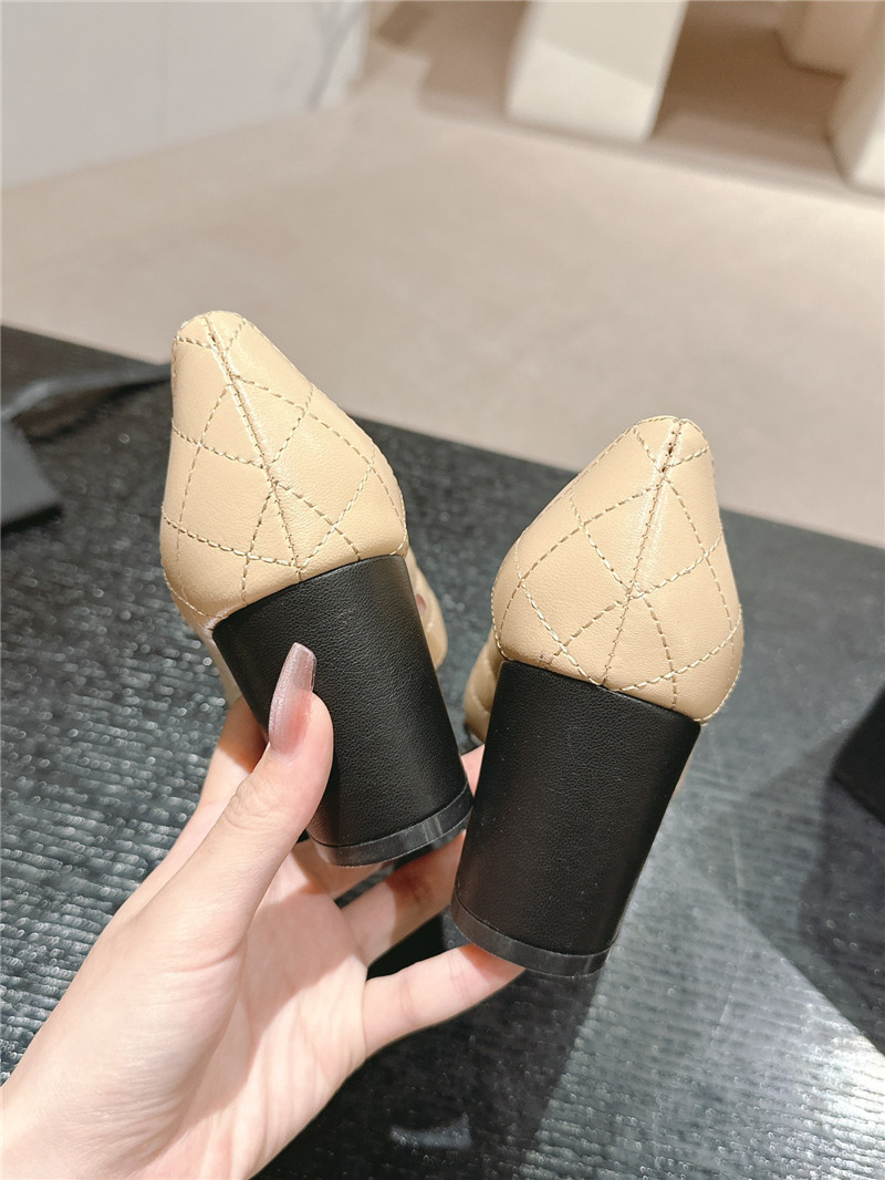 Ch**el beige/black quilted leather cap toe pumps