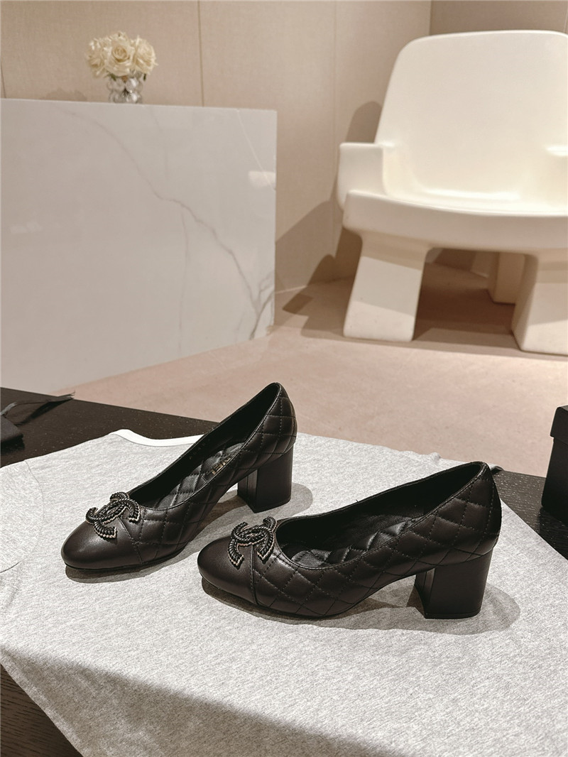 Ch**el black quilted leather cap toe pumps