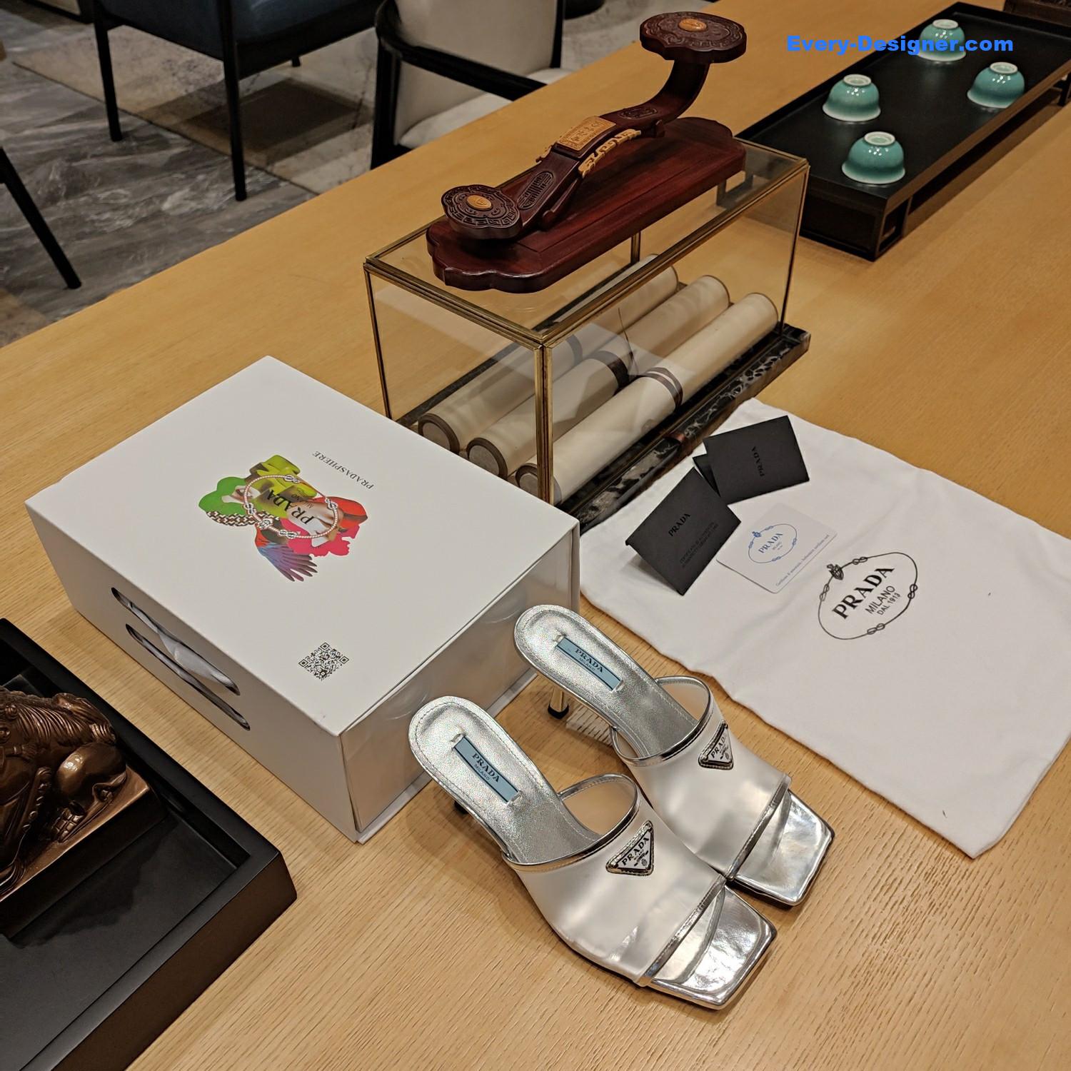 Pra*a metal logo triangle head square sandals