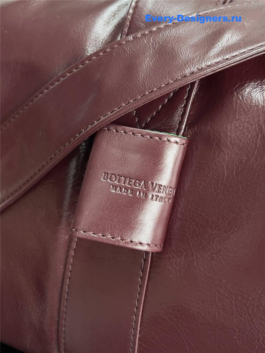 b0tt*ga Ven*ta wine red leather travel bag