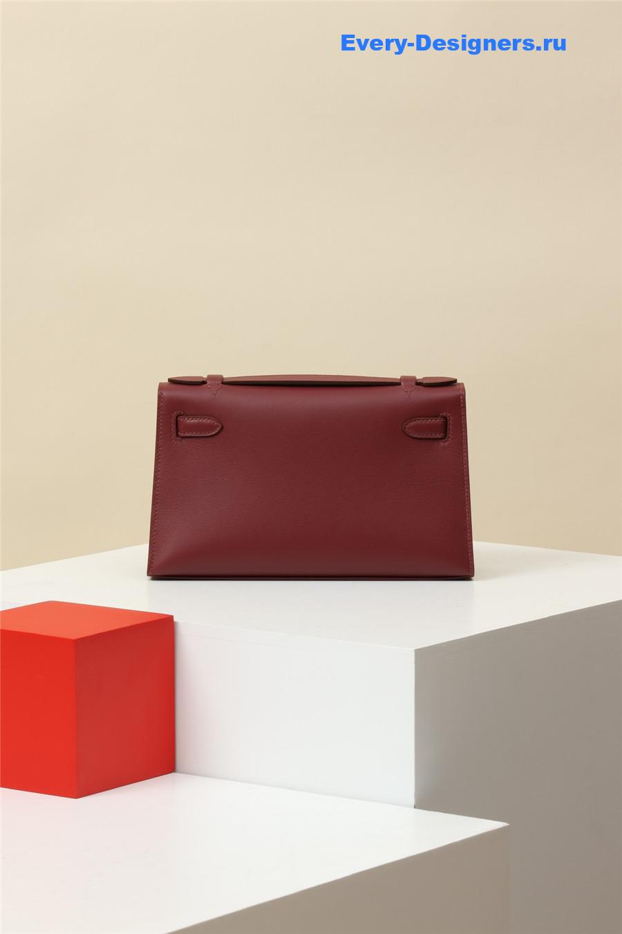 H**me5 kelly pochette swift leather bag red