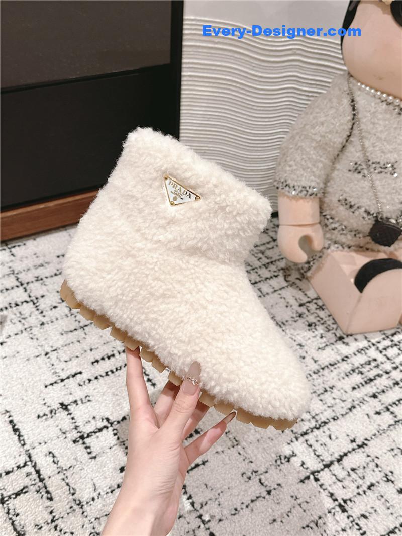 Pra*a white shearling booties