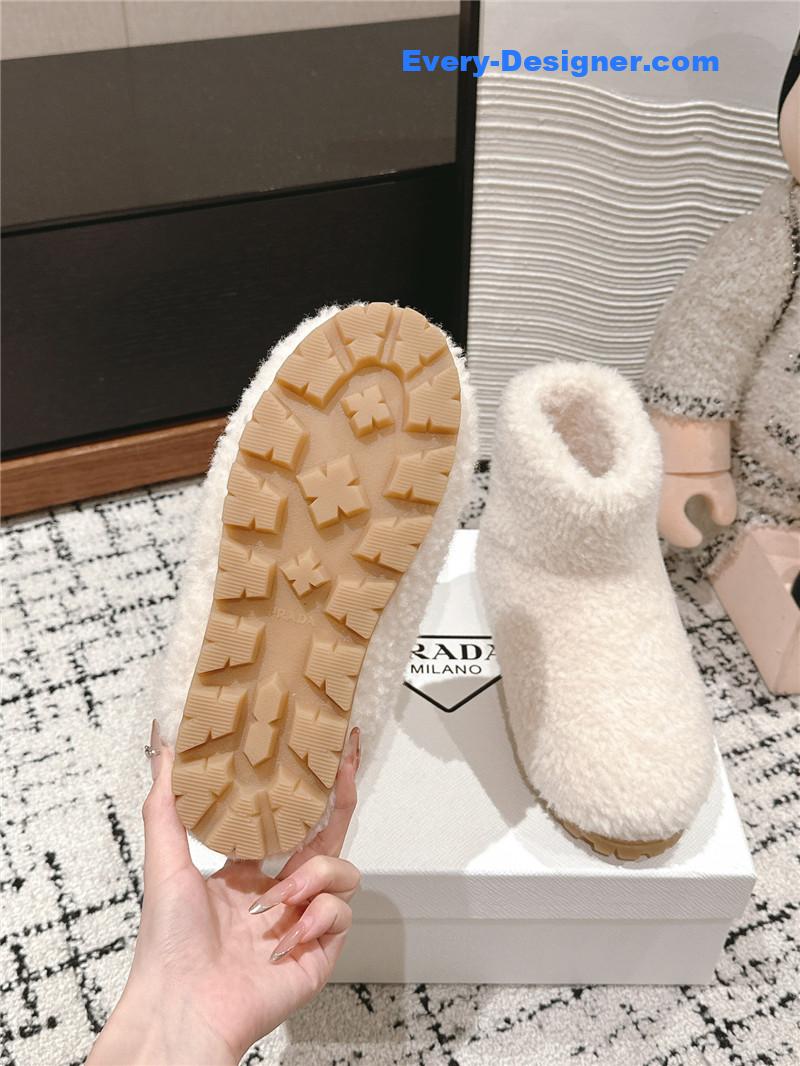 Pra*a white shearling booties